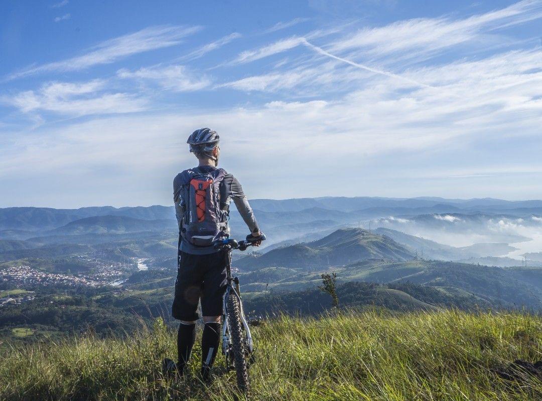 Mountain biker enjoying the valley view